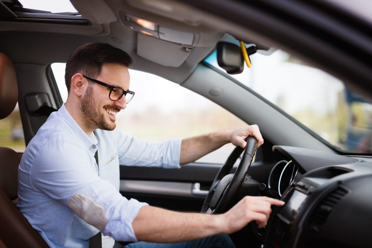 Man using modern navigation system while driving car